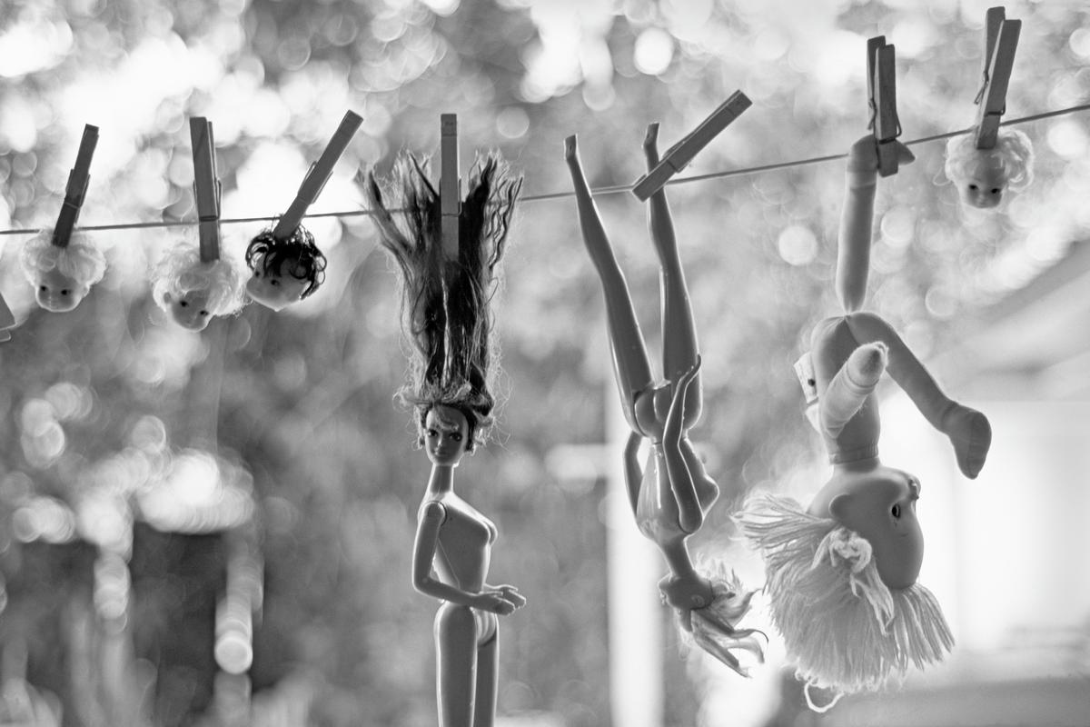 USA. ARIZONA. Mesa. Backyard Barbie Doll washing line is surreal. 1992.