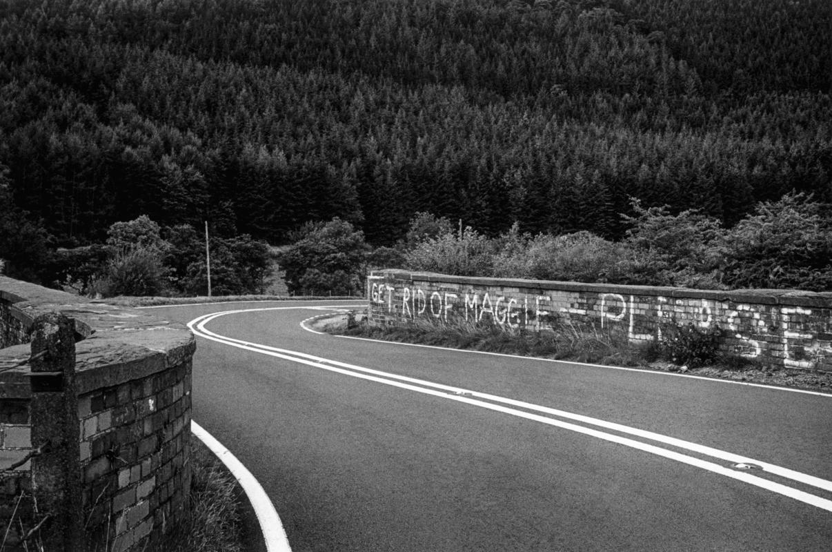 GB. WALES. Commins Coch. Polite Welsh anti Thatcher graffiti more biteing because of its apparent gentleness. 1989.