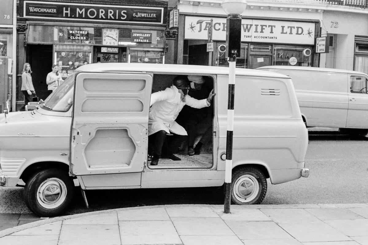 GB. ENGLAND. London. Queensway. Smash and grab raid on A B David jewellers and Silversmiths. Photographed when I was on my way to my ritual morning coffee. Published as a wrap around cover of the Sunday Mirror. 1969. (Image 3/8)