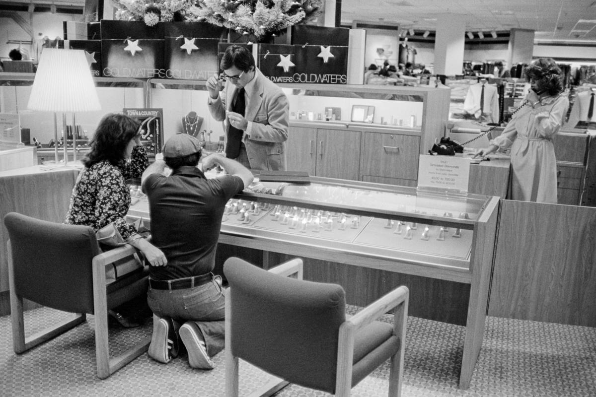 USA. ARIZONA. Phoenix. Wedding ring choice at the largest department store in Arizona, Goldwaters. 1979.