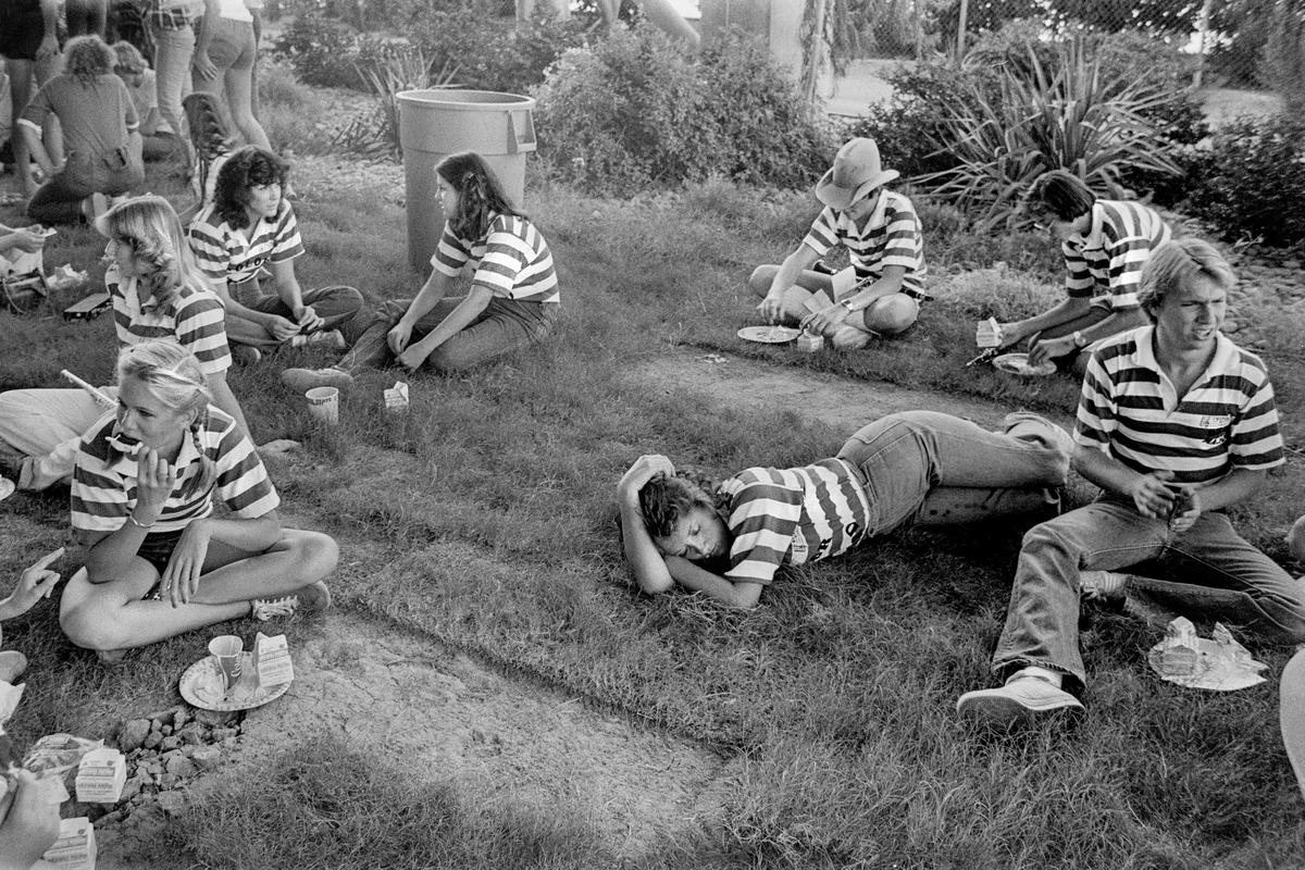 USA. ARIZONA. Tempe. A.S.U. v Utah football game. Arizona high school supporters rest outside the stadium. 1979.