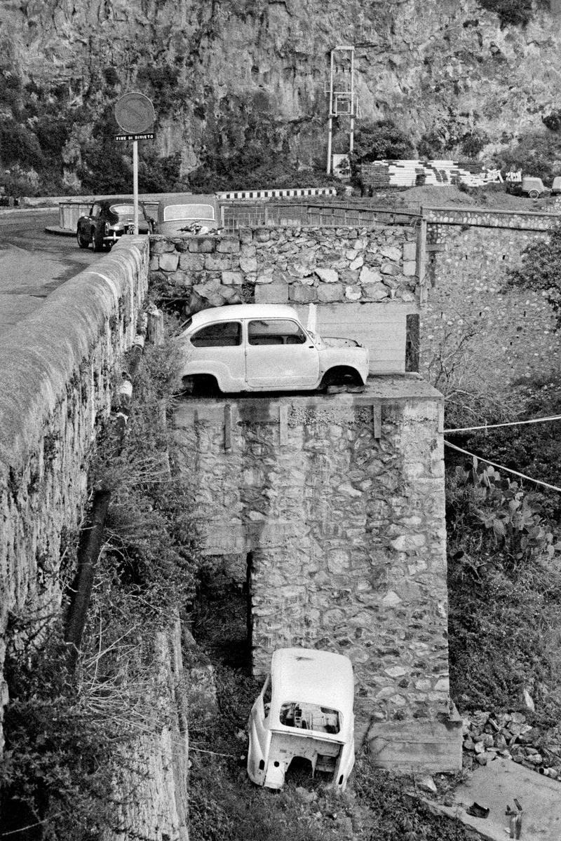 ITALY. Positano. Old cars on the outskirts of the town. 1964.