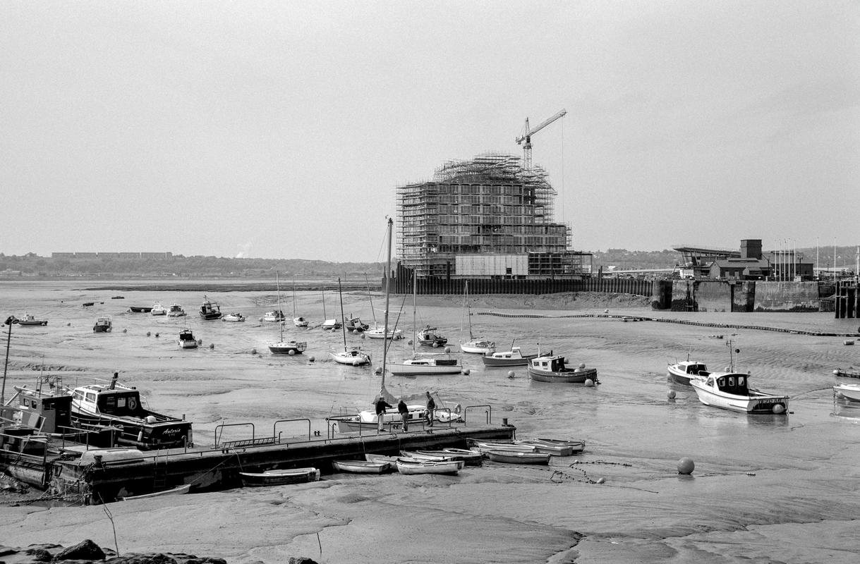 GB. WALES. Cardiff. Bute Town - once known as 'Tiger Bay'. Mudflat view with the building of St David's Hotel & Spa in the distance. 1998