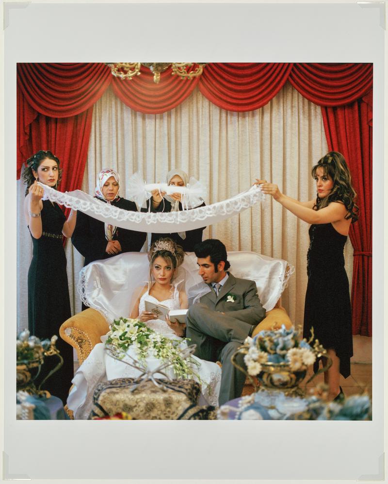 A family perform wedding rituals at a public wedding hall in Tehran. Iran