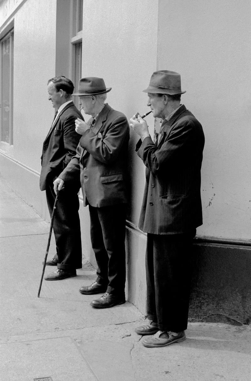 IRELAND. Kenmare. County Kerry. People watching on the street in Kenmare. 1968.