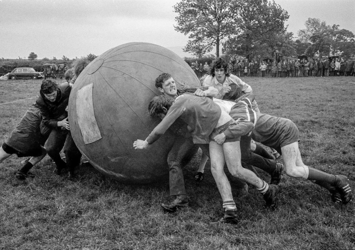 GB. WALES. Brecon. A game of push ball.  Two teams try to push a large inflated ball over the opposition's goal line.  Taking place at the Young Farmers' meeting. 1973
