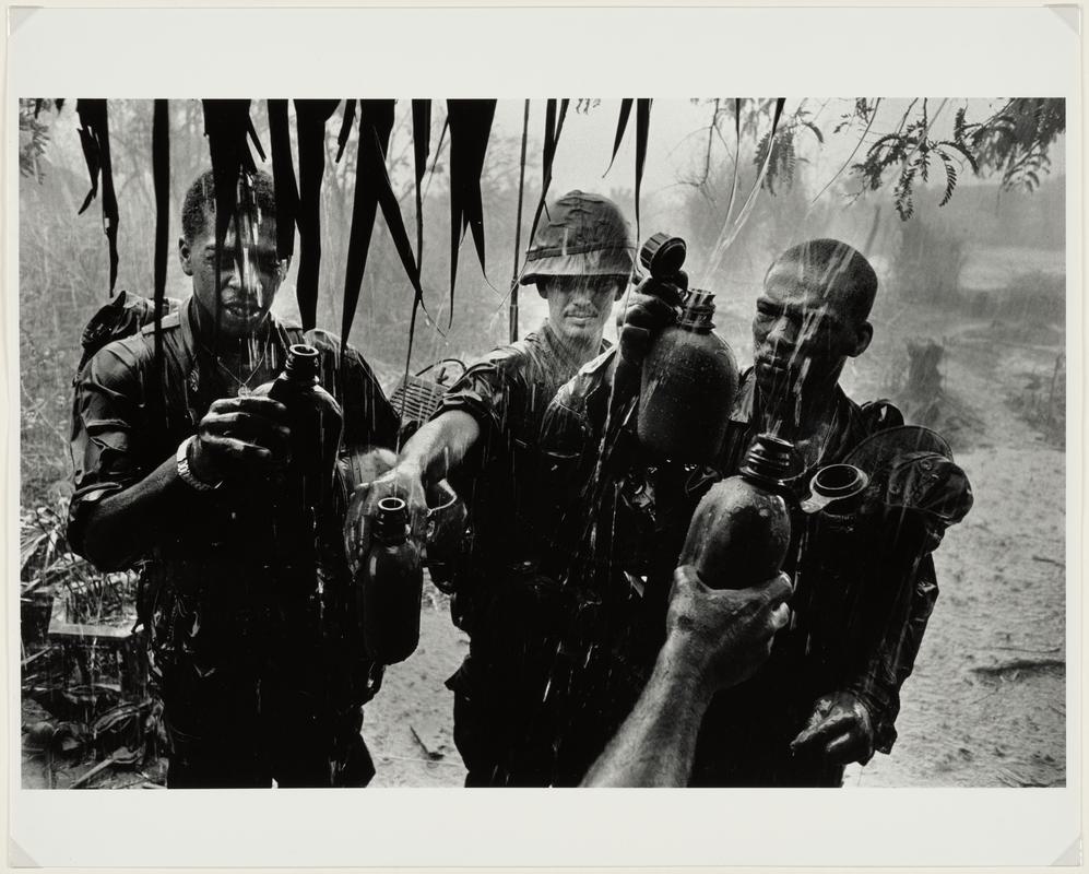 G.I.'s filling water bottles, Vietnam, 1968