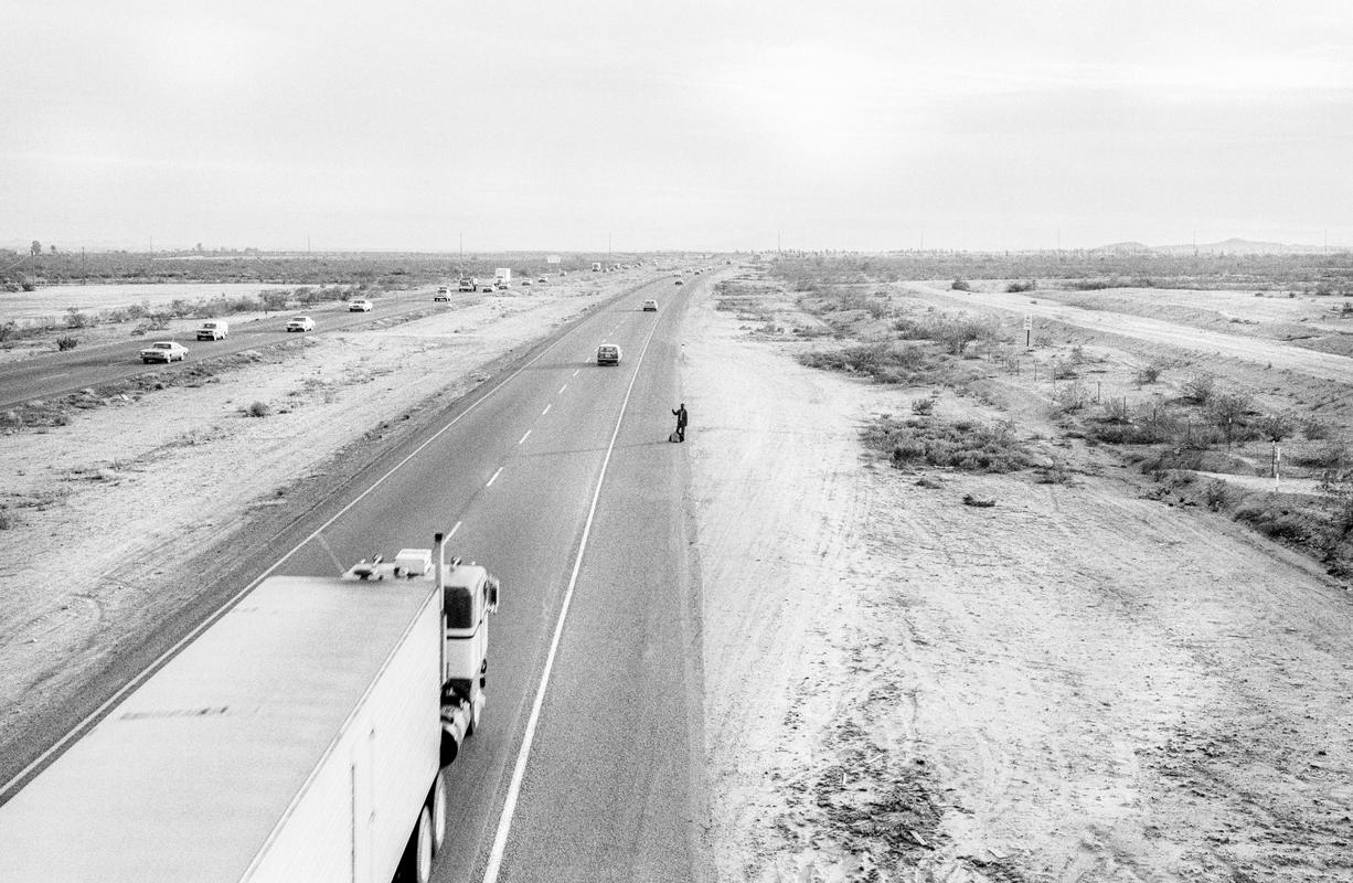 USA. ARIZONA. Phoenix. Hitchhiking on the road south out of Phoenix, open space for a hundred miles to Tucson. 1978