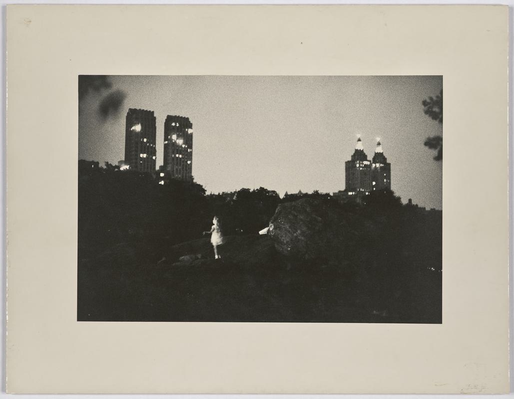 Girl playing on rocks of Central Park, New York City, USA