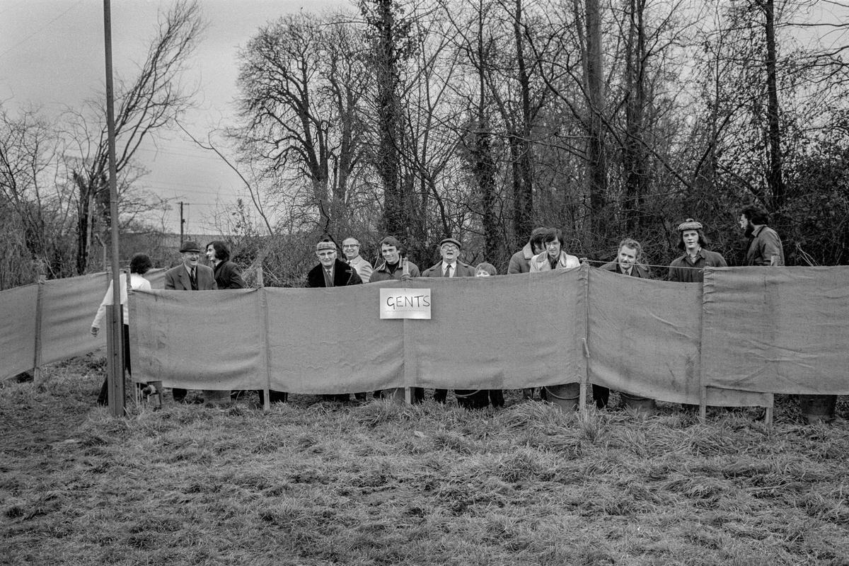 GB. WALES. Abertillary. Local rugby spectators in the Gents. 1974