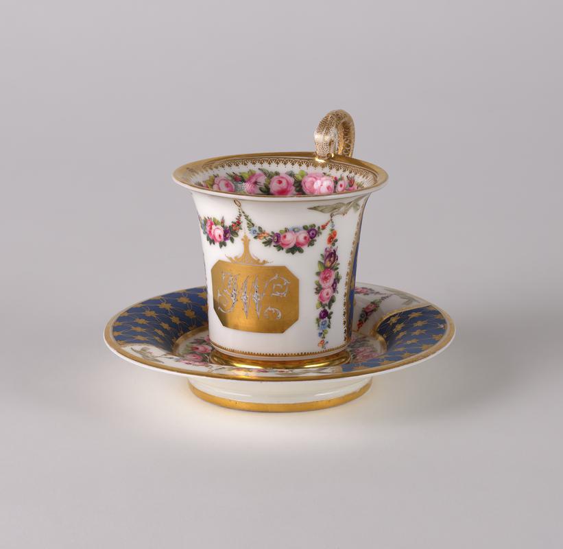 Cup, cabinet and saucer