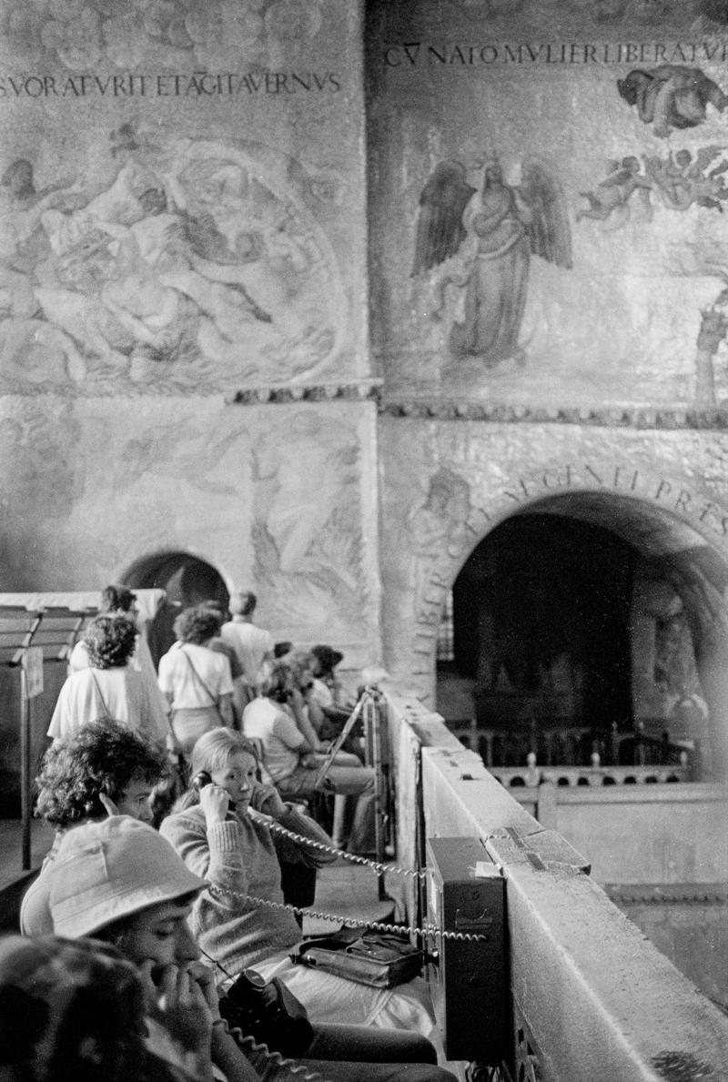 ITALY. Venice. Inside St Marks Basilica Cathedral, tourists listening to history. 1999.