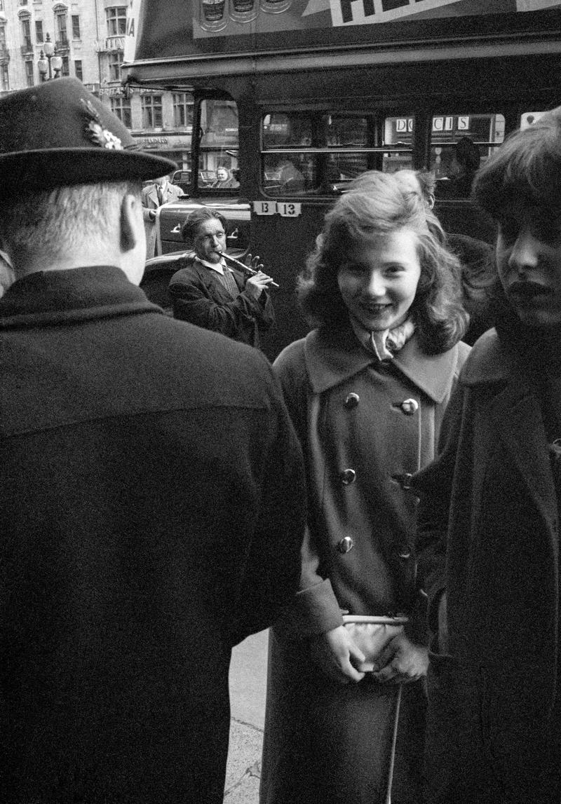 GB. ENGLAND. London. Musical interlude in Piccadilly Circus London. Taken on a Contax 2 camera (first professional camera). 1958.