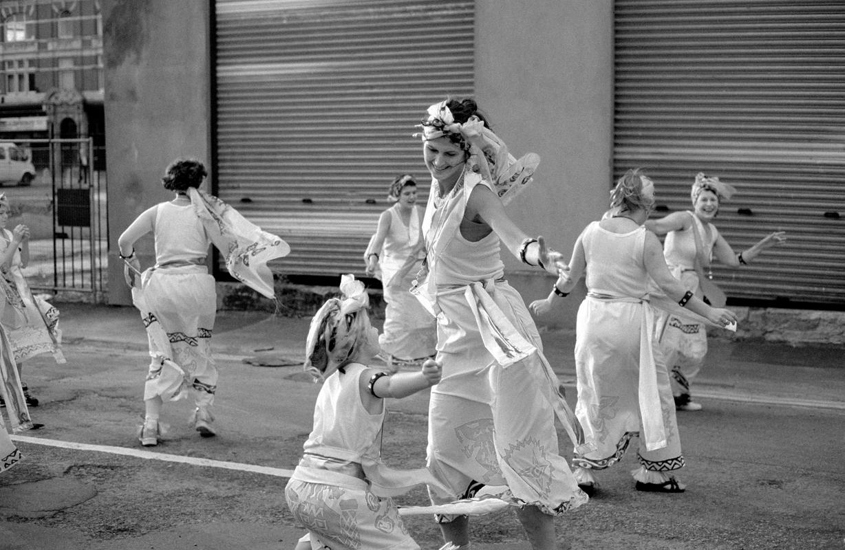 GB. WALES. Cardiff. Butetown - once know as 'Tiger Bay'. Dancers in costume at the annual Butetown carnival. 2000