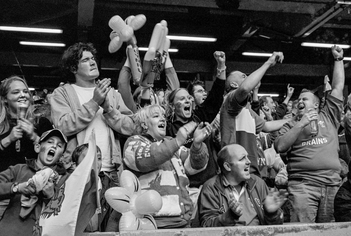 GB. WALES. Cardiff. Spectators celebrate Wales try against South Africa. 2004.