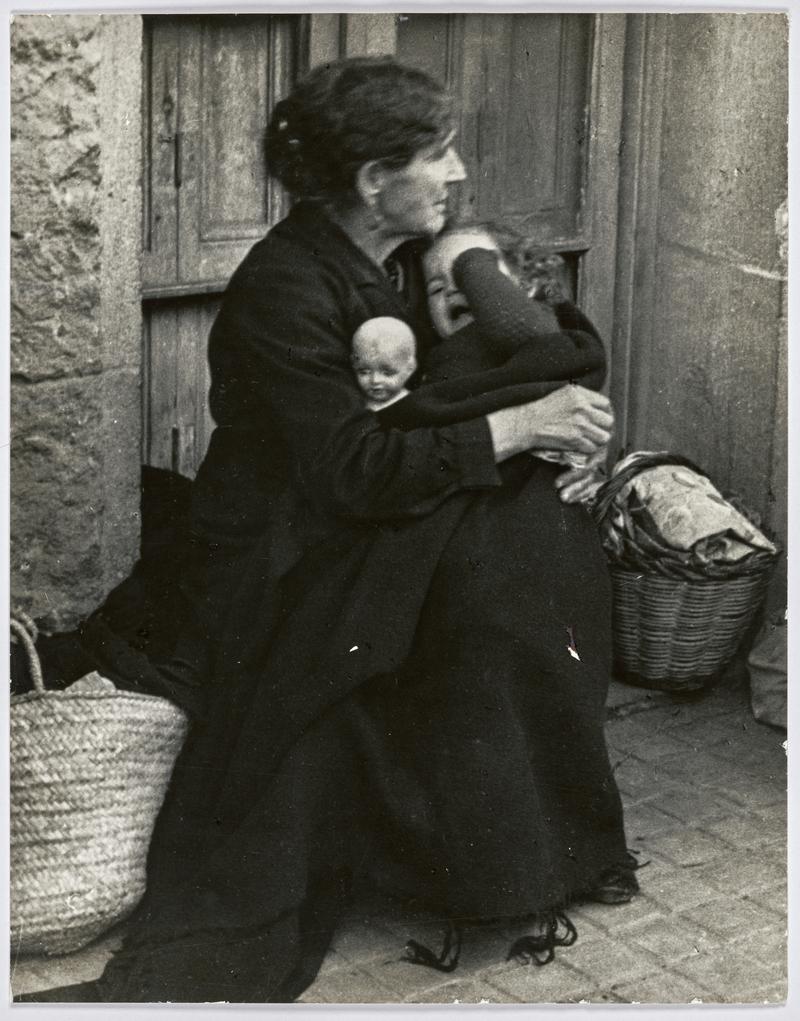 At a refugee transit center during the evacuation of the city, which was being heavily bombed by fascist planes, as General Franco's fascist troops rapidly approached