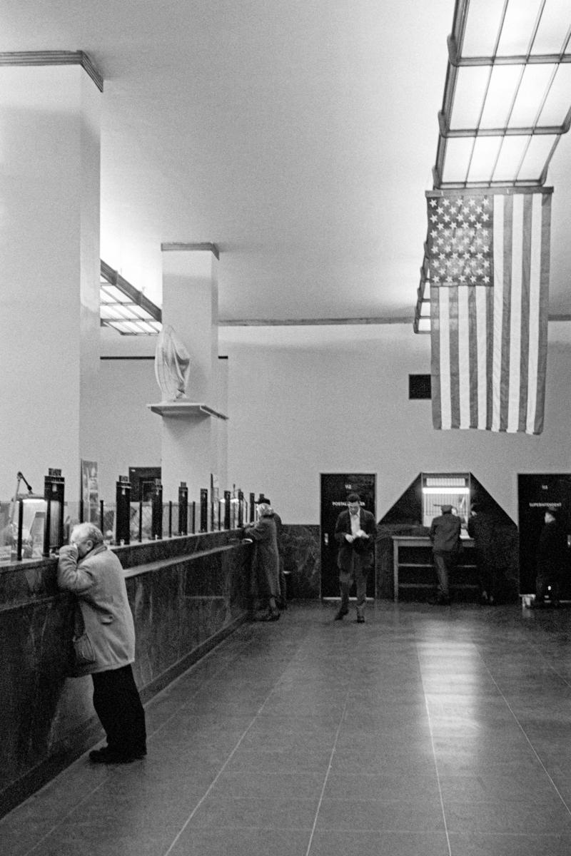 USA. NEW YORK. Manhattan. Interior of bank and the American flag. 1962