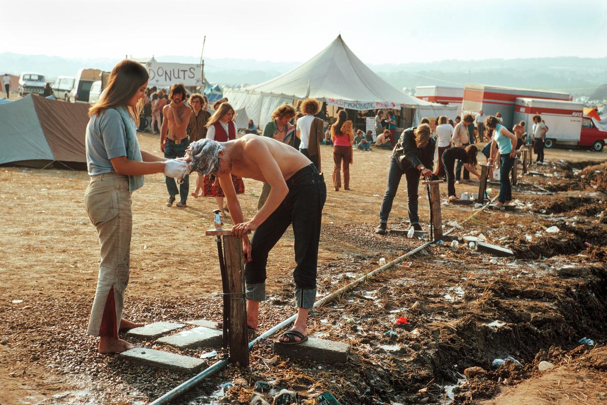 GB. ENGLAND. Isle of Wight Festival. Water is provided for washing. Although cold, it is a friendly communal affair. 1969.