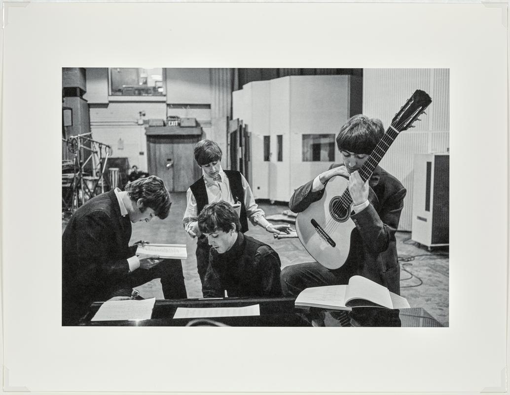 The BEATLES in the Abbey Road Studios, where many of their most famous records were made, examining the script of the film 'A Hard Days Night'. London, England