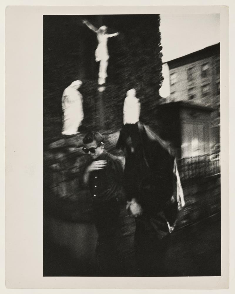 Brooklyn Gang. Bengie (left) crossing himself in front of Holy Name Church