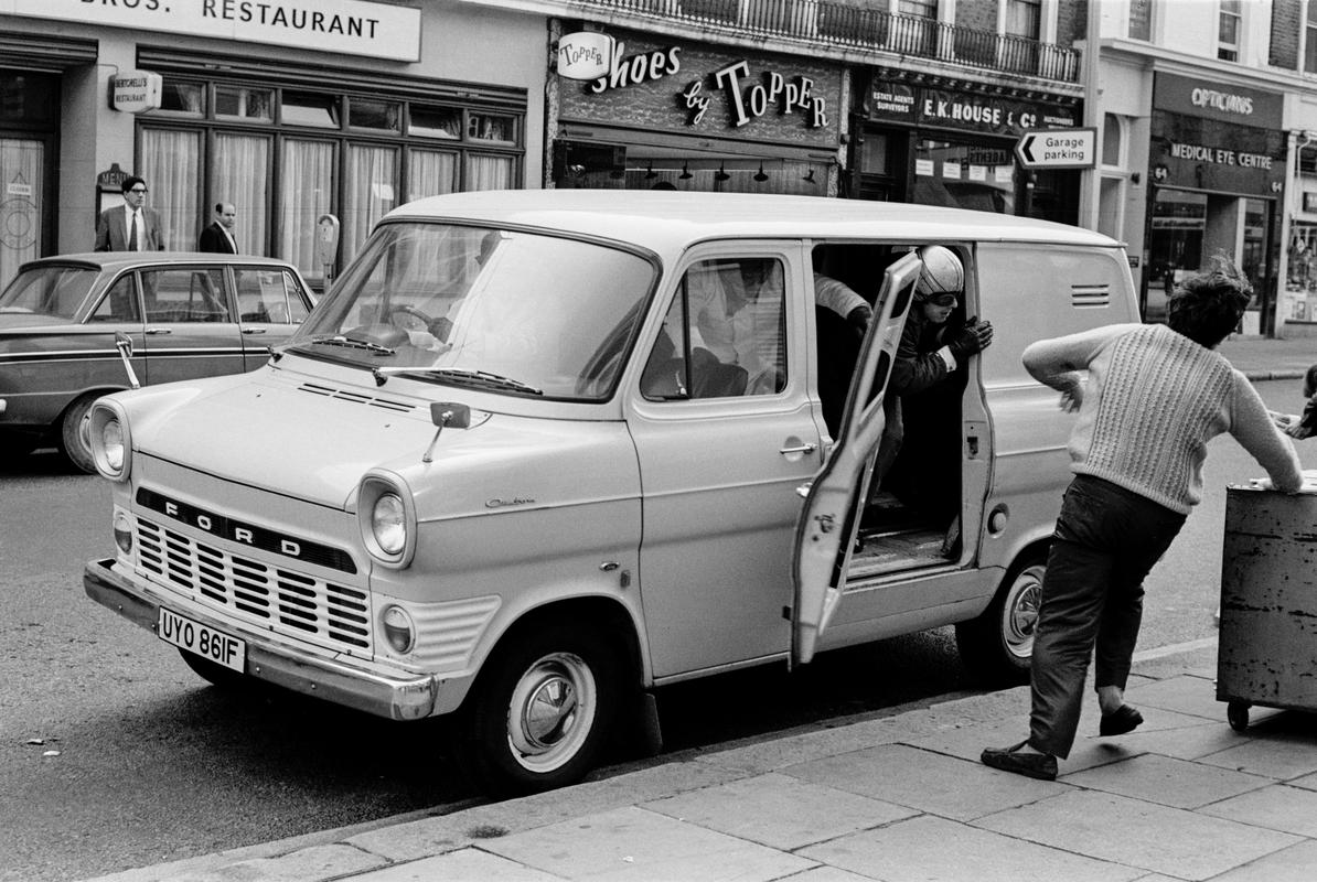 GB. ENGLAND. London. Queensway. Smash and grab raid on A B David jewellers and Silversmiths. Photographed when I was on my way to my ritual morning coffee. Published as a wrap around cover of the Sunday Mirror. 1969. (Image 2/8)