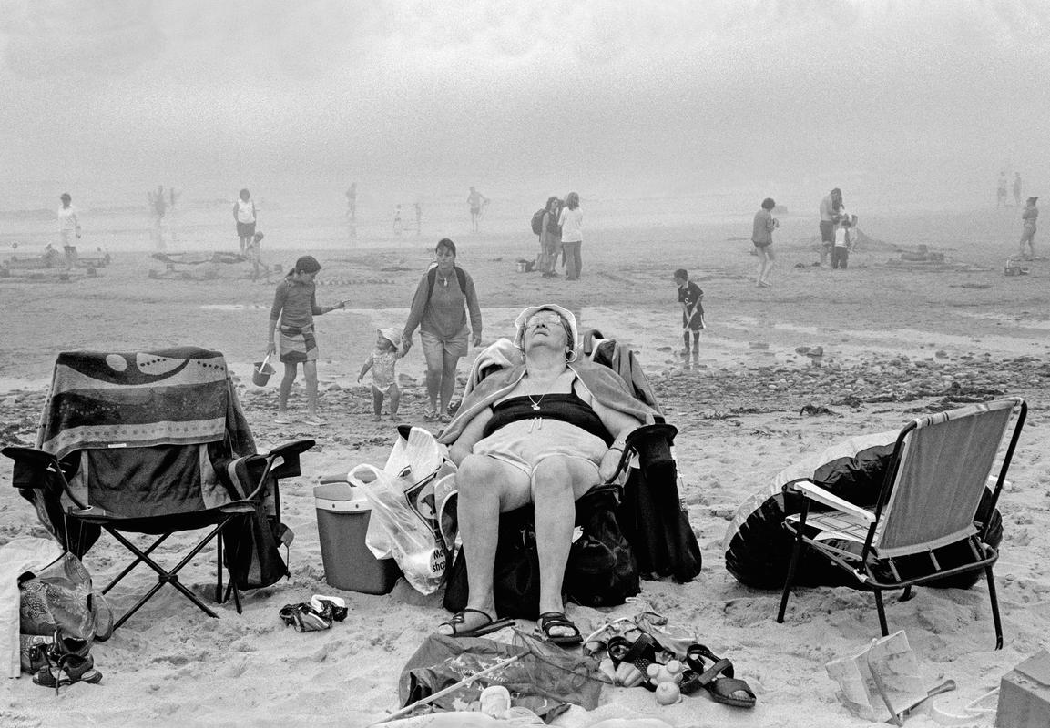 GB. WALES. Porth Oer (Whistling Sands). Enjoying the beach. 2004.