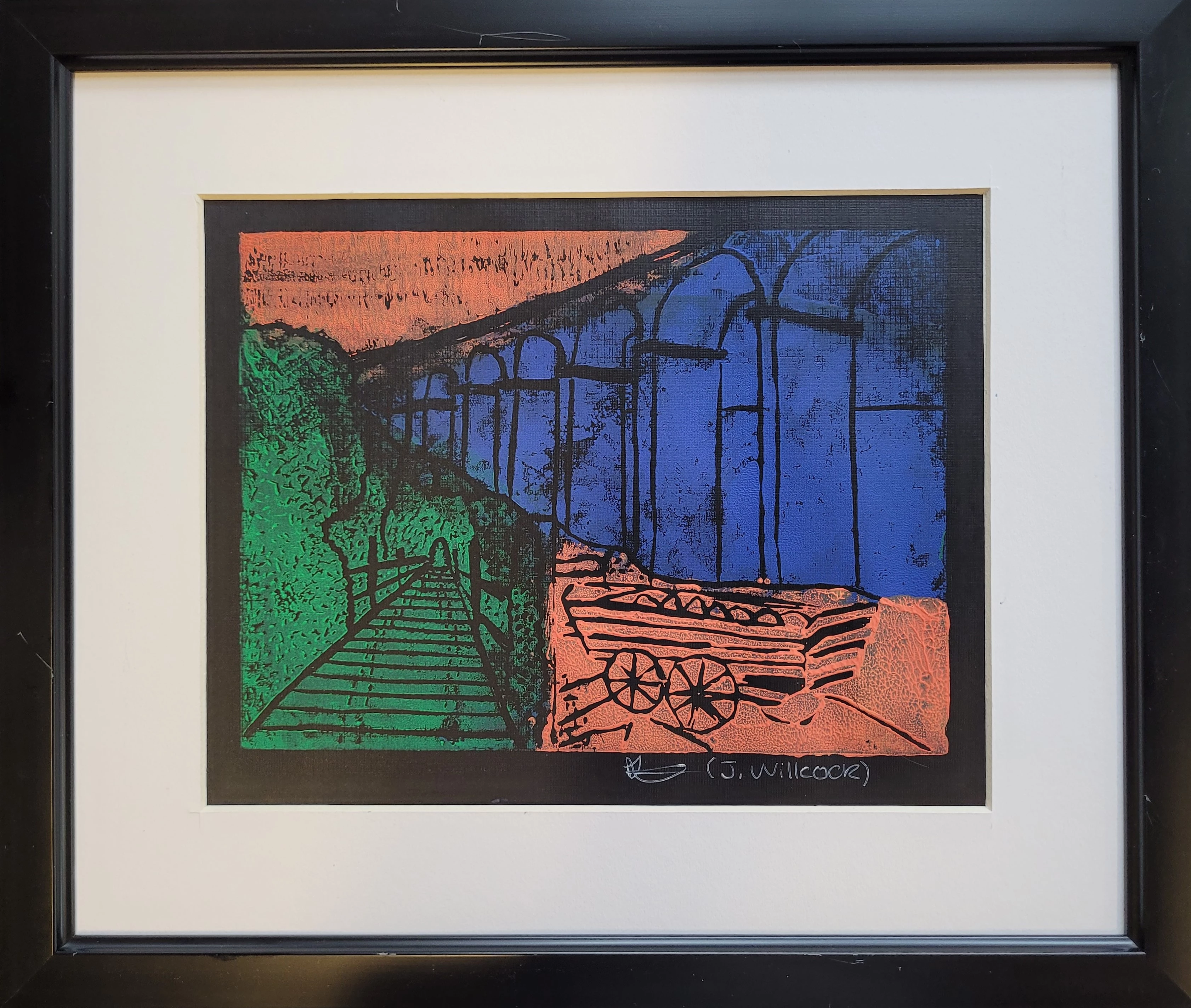 Print leino o draphont gyda chert mewn 3 lliw cryf: gwyrdd, glas ac oren. Y draphont sy'n las.